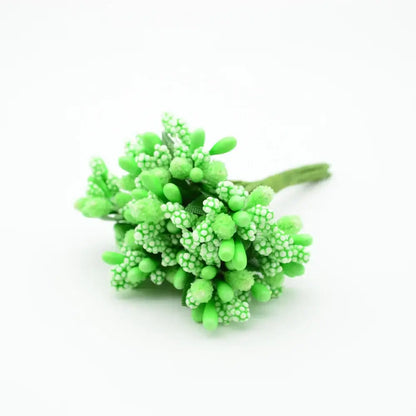 A vibrant lime green decorbites artificial stamen flower cluster with textured bead-like petals and a slender stem