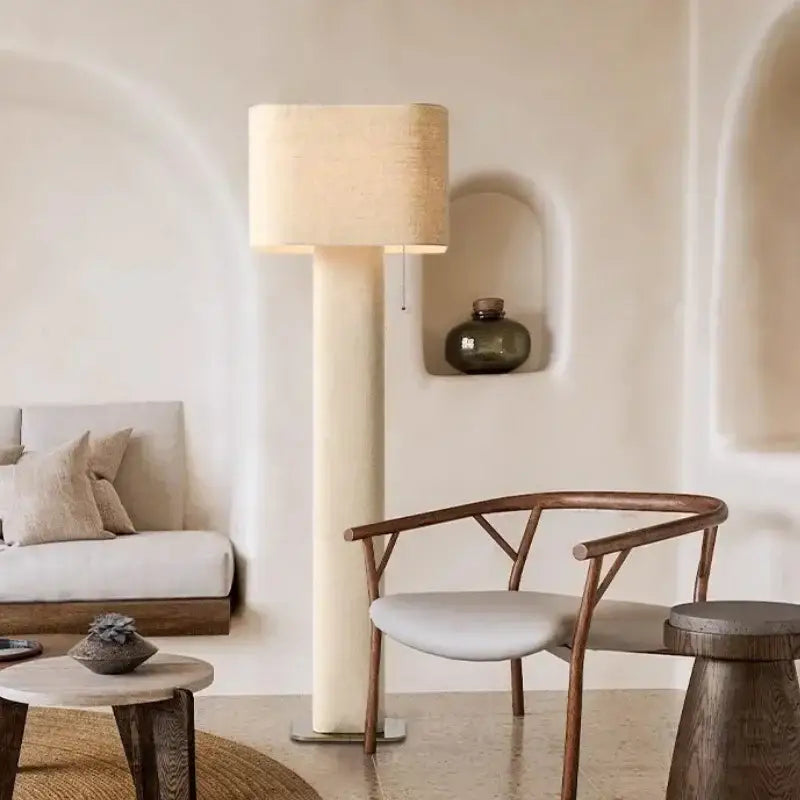 Cream-colored decorbites artistic floor lamp with textured fabric shade and minimalist design for living room or bedroom