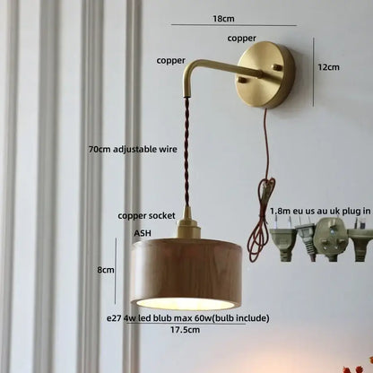DecorBites ash wood wall lamp with warm copper finish, cylindrical wooden shade, and adjustable braided cord