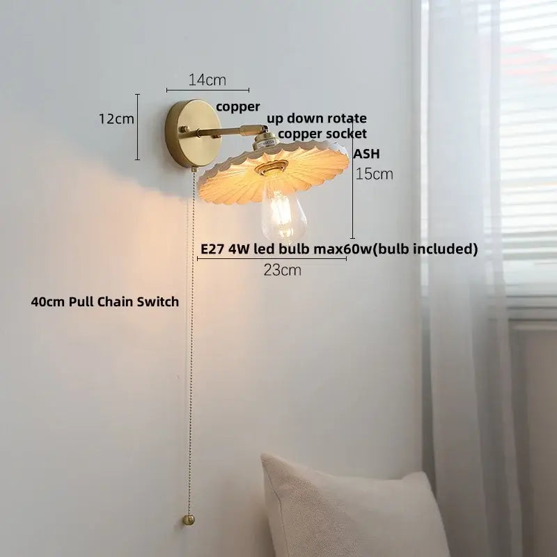 Copper wall sconce with scalloped translucent amber glass shade and exposed edison bulb in decorbites ash wood led style