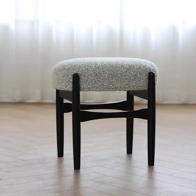DecorBites ash wood makeup bench with a minimalist black wooden frame and round gray fabric seat for small spaces