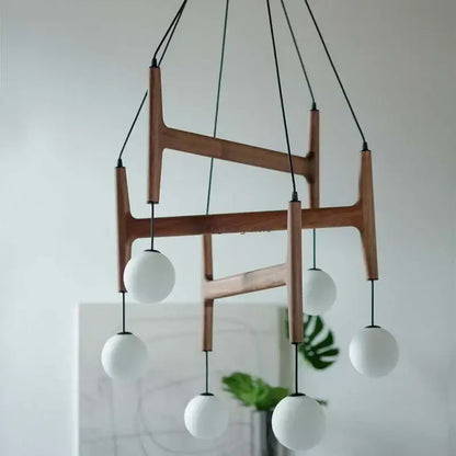 Modern wooden chandelier with five white glass shades and black cords decorbites astra wood pendant light interior lamp