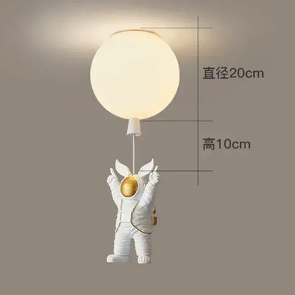 White DecorBites astronaut balloon ceiling lamp holding a glowing spherical LED light for kids room decor