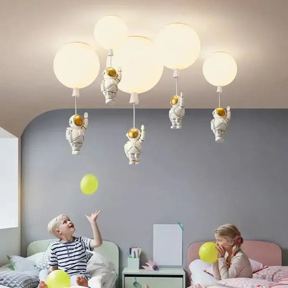 White decorbites astronaut balloon ceiling lamp with gold accents and spherical LED bulbs for kids room lighting
