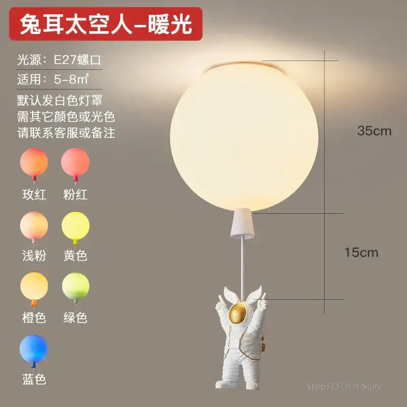 White decorbites astronaut balloon pendant light featuring gold accents and warm led light for children’s nursery room