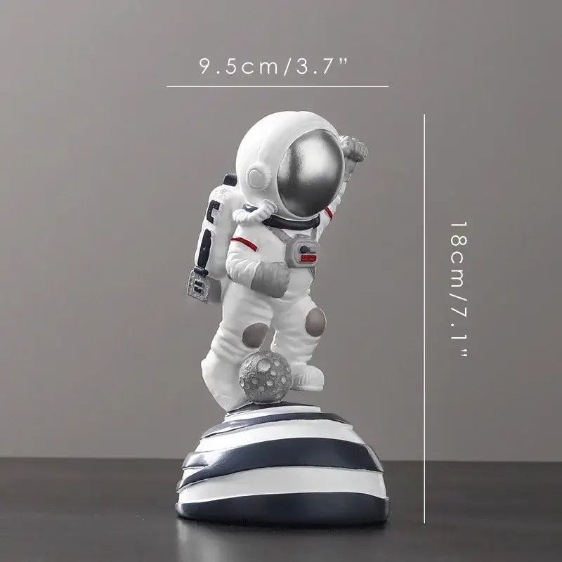 DecorBites astronaut figurine abstract sculpture in white with silver helmet and red accents on striped base for modern decor