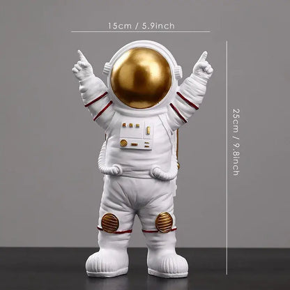 White astronaut figurine with gold helmet and red trim featuring detailed suit panels from decorbites astronaut figurines