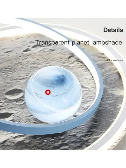 Transparent spherical decorbites astronaut led chandelier with blue gradient and red dot against lunar surface backdrop
