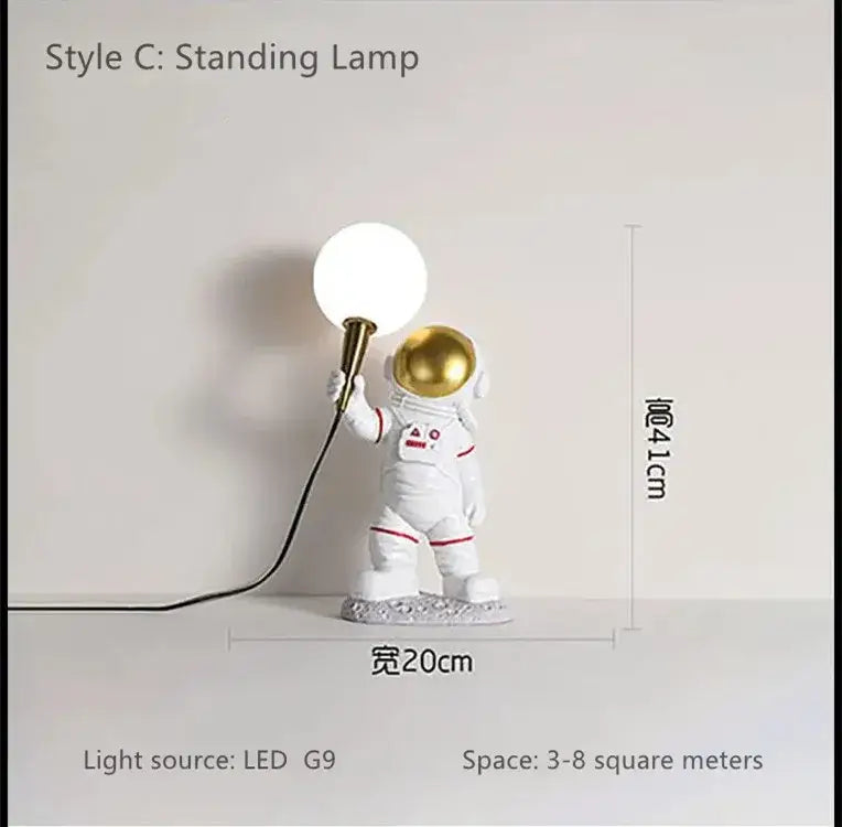 White resin decorbites astronaut led desk lamp with gold helmet red trim holding spherical led light for modern use