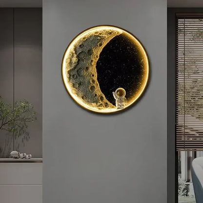 Decorbites™ astronaut led wall lamp featuring a glowing circular moon with metallic gold crescent and resin astronaut figurine