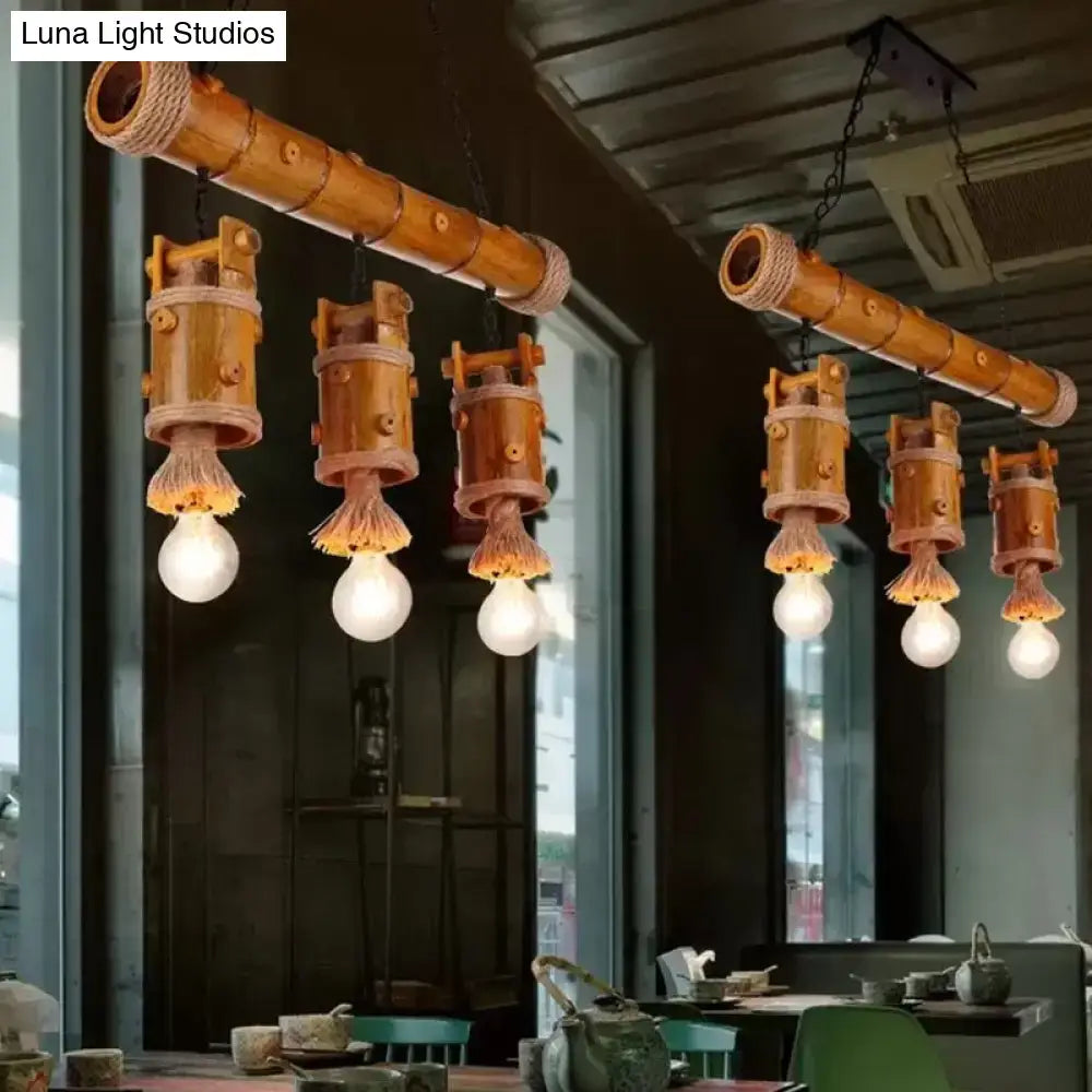 Rustic bamboo chinese bucket pendant lamp with warm brown cylindrical tubes and woven rope accents for island lighting