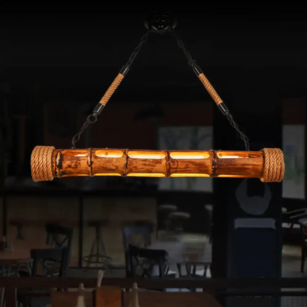 Decorbites bamboo pole led light fixture in warm tones with woven rope and metal chains for lodge style dining room