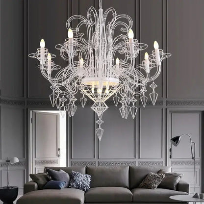 An ornate white decorbites baroque iron designer led chandelier with intricate wireframe and crystal accents for foyers