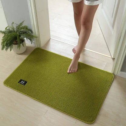 A soft olive green decorbites bathroom mat with a plush textured surface and rounded edges for non slip use