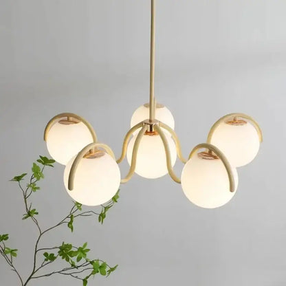 Modern brass-finished decorbites bean glass pendant light with five frosted glass globes for living room and bedroom