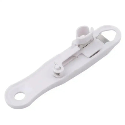 White plastic decorbites bean slicer cutter with built-in bottle opener and small loop kitchen gadget