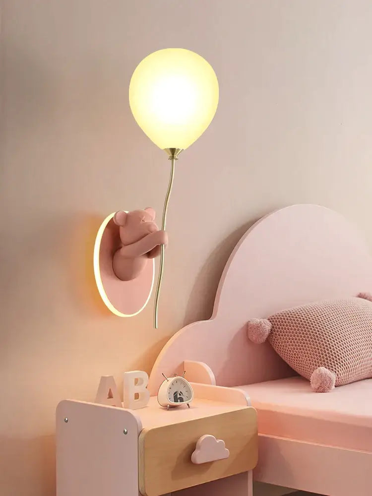 Pastel pink decorbites bear artistic wall lamp shaped like a bear holding a glowing yellow balloon for kids room decor