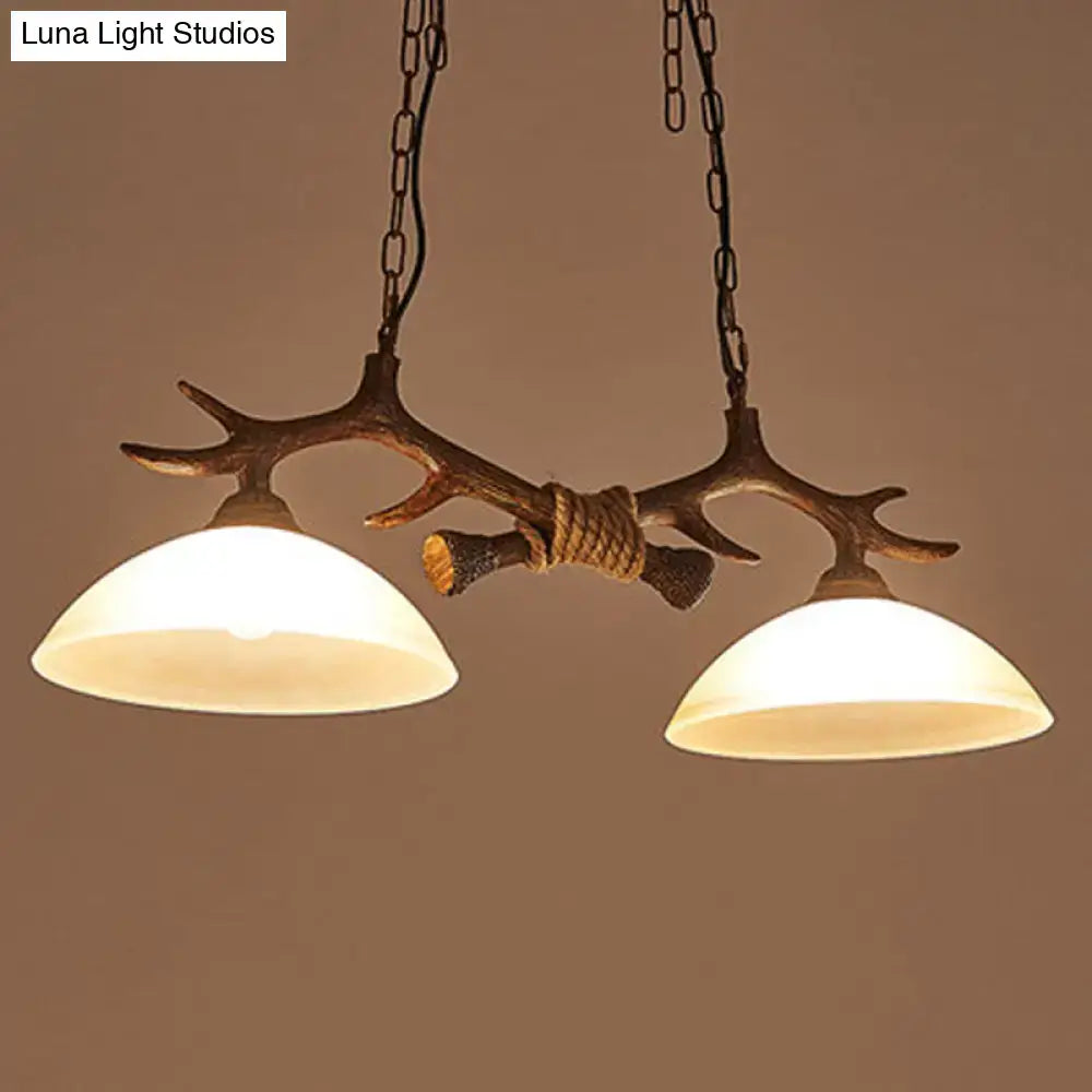 DecorBites™ beige glass dark coffee pendant ceiling light with antler decor and two warm-toned glass shades suspended by chains