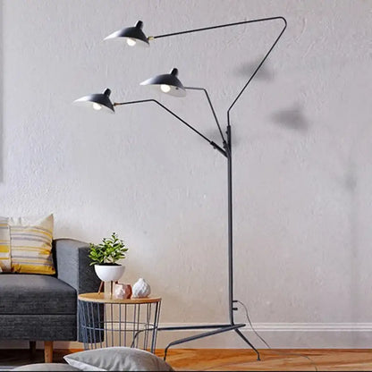 Black aluminum nordic floor lamp by Decorbites with three adjustable arms and white conical shades for living room