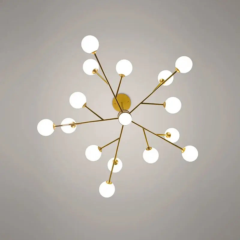 Gold-toned decorbites black chandelier with white frosted glass globe bulbs in a starburst design for living room lighting