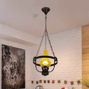 DecorBites black crackle glass pendant light with metal ring and glowing yellow bulb in classic vase shade design