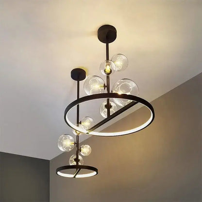 Modern black metal led pendant chandelier with clear glass spheres and circular led rings for dining room and kitchen
