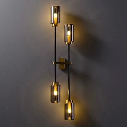 Modern brass and smoked glass DecorBites black glass wall lamp with three cylindrical light fixtures for living room decor