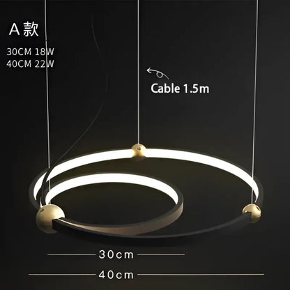 Modern minimalist decorbites black gold chandelier with two concentric led rings and polished brass connectors suspended by cables