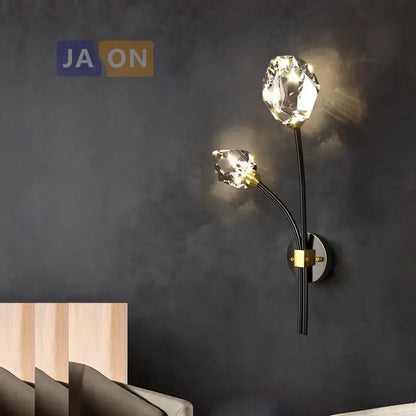Elegant black metal wall sconce light with gold accents and two faceted crystal bulbs for bedroom and corridor use