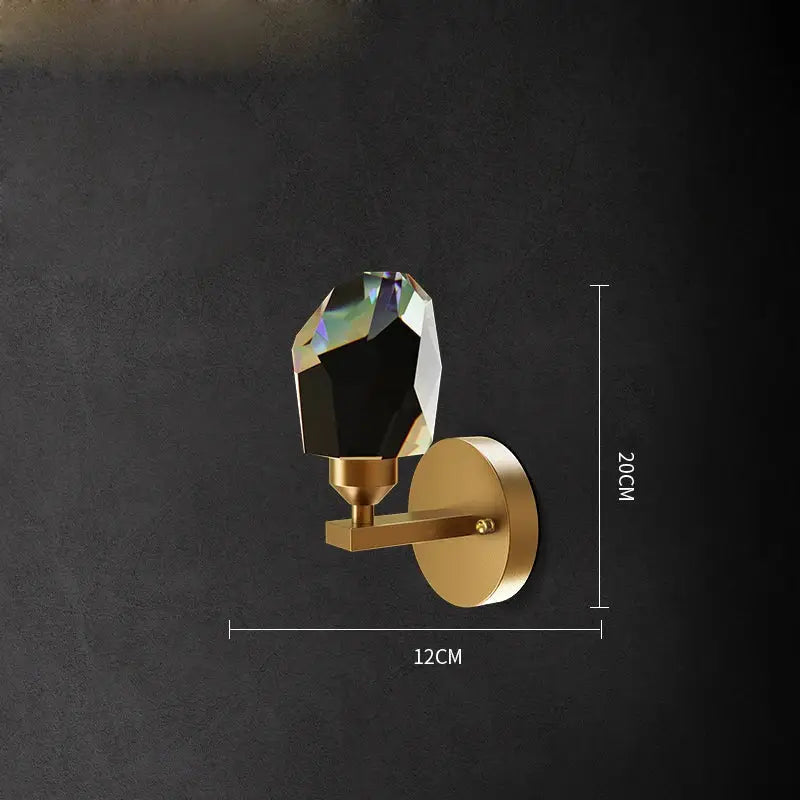 Gold-toned DecorBites wall sconce light with faceted black crystal bulb for bedroom corridor lighting