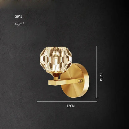 Gold-finished DecorBites wall sconce light with faceted crystal globe for bedroom corridor lighting