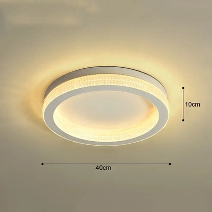 Modern decorbites black gold crystal chandelier ceiling light with sleek white frame and warm glowing LED for living room