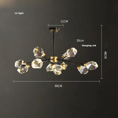 Modern decorbites black gold crystal chandelier with twelve faceted LED lights suspended from black rod and gold hub