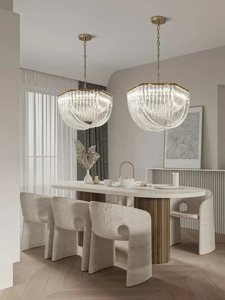 Two elegant decorbites black gold crystal pendant lights with cascading glass strands for luxury dining decor
