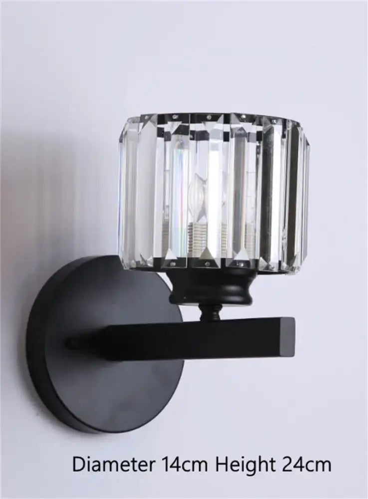 Black metal DecorBites black gold crystal wall light with cylindrical crystal shade for bedroom and living room use