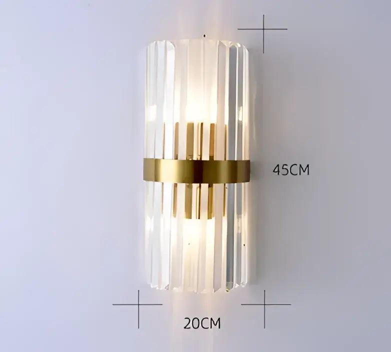 A modern decorbites black gold crystal wall sconce with vertical clear glass prisms and a gold-toned band for indoor use