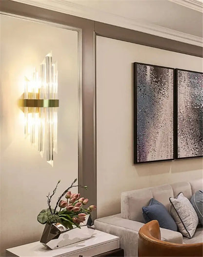 Gold-toned decorbites black gold crystal wall lights with vertical prisms casting warm light for bedroom and living room