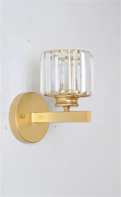 DecorBites black gold crystal wall sconce with cylindrical faceted crystal shade for bedroom and living room decor