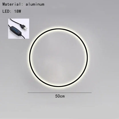 Circular aluminum led wall light with a sleek black frame and usb plug by decorbites black gold for bedroom use