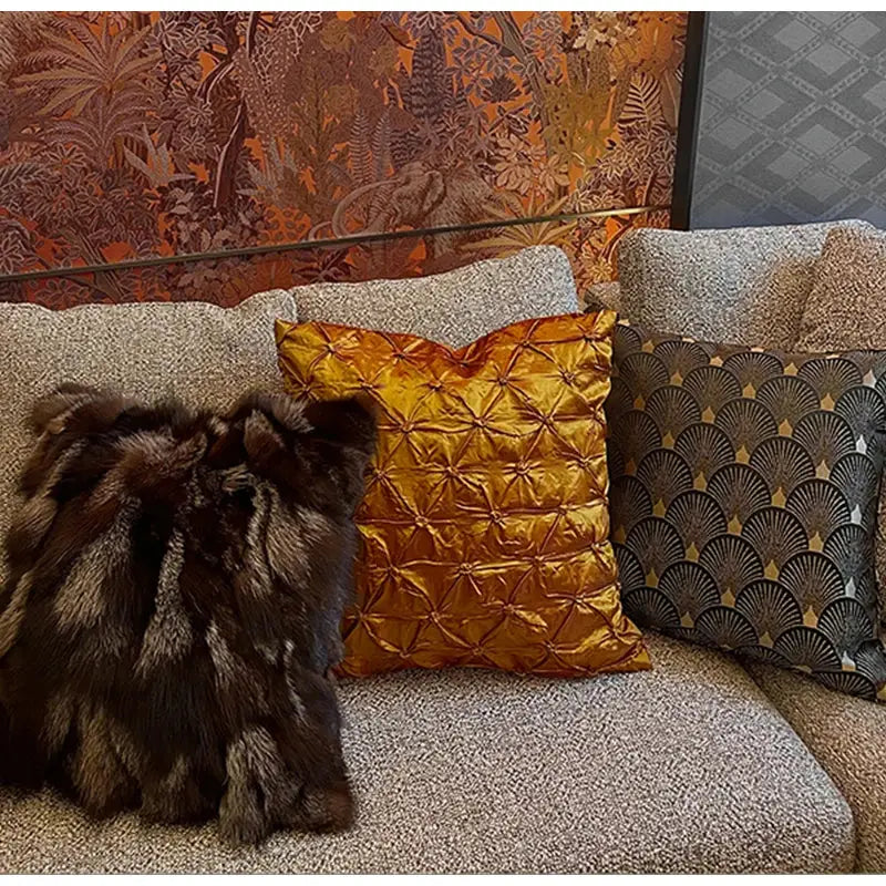 Golden satin throw pillow case with quilted starburst pattern from decorbites black gold geometry collection