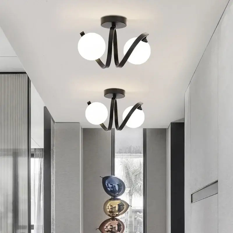 Modern minimalist decorbites black gold ceiling light with black metal and glowing white glass bulbs for indoor use