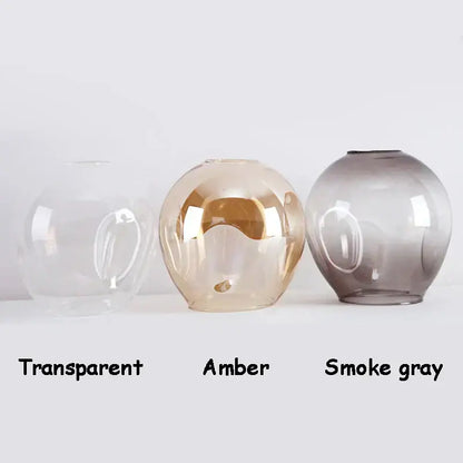 Decorbites black gold wall lamps with three spherical glass shades in transparent amber and smoke gray finishes for modern lighting