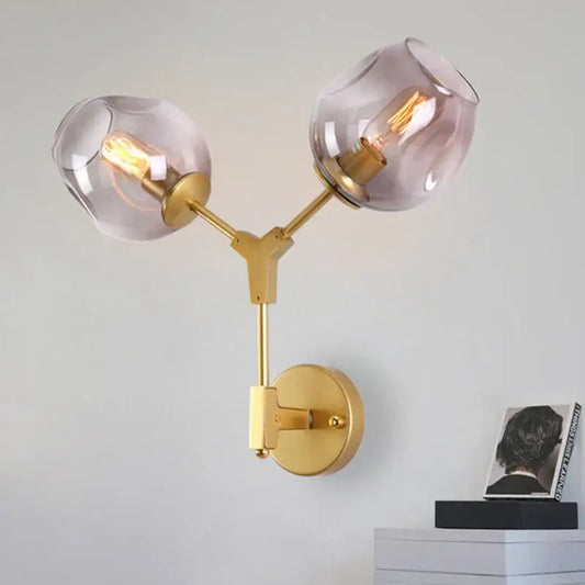 Decorbites black gold wall lamps featuring gold-toned metal with two frosted glass globe shades for modern lighting