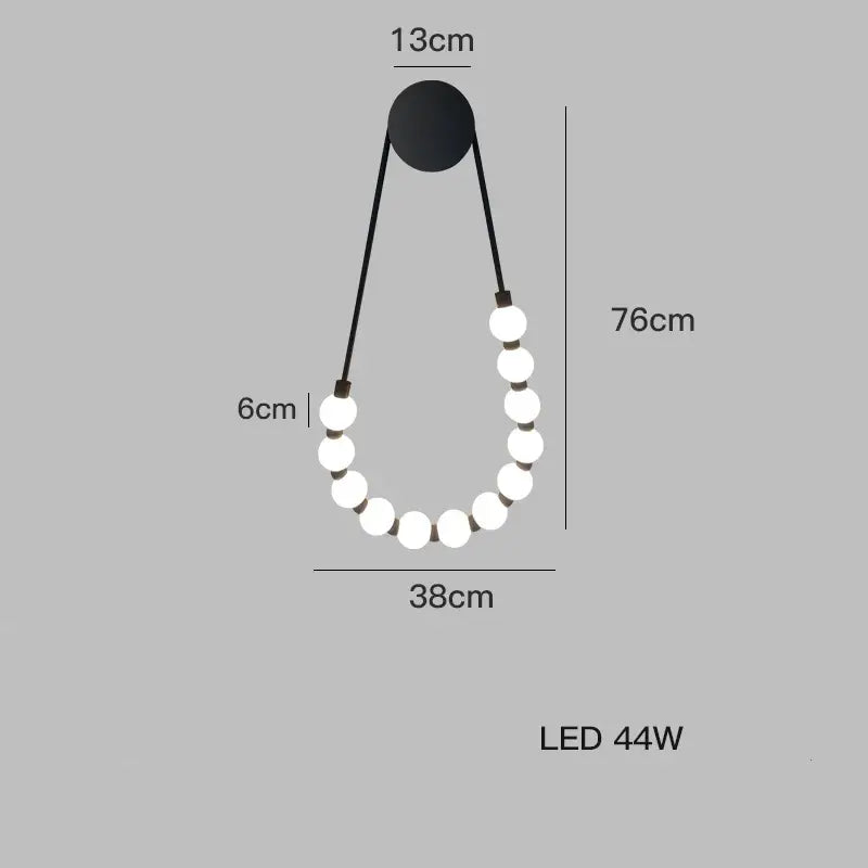 DecorBites black gold LED wall lamp with black pendant and ten glowing white spherical bulbs for bedroom and corridor