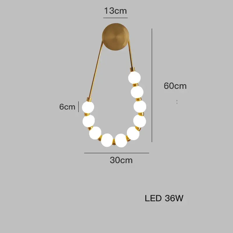 Gold-toned DecorBites black gold wall lamp with seven white LED bulbs in an elegant curved design for bedroom and corridor