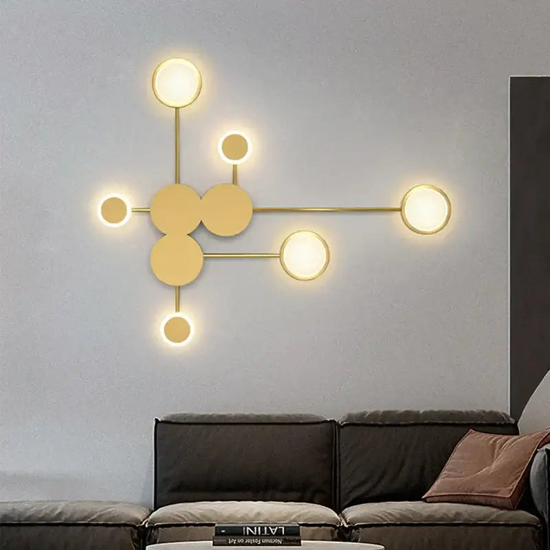 Modern gold-toned DecorBites black gold LED wall lamp with molecular circular light fixtures for indoor spaces
