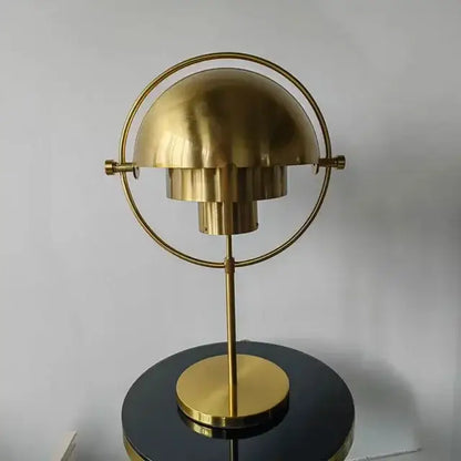 Brass-colored flower-shaped decorbites black gold metal floor lamp with circular ring and tiered petals for modern décor