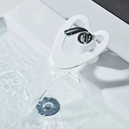 White ceramic basin faucet with sleek modern design and black handle for DecorBites waterfall basin faucet