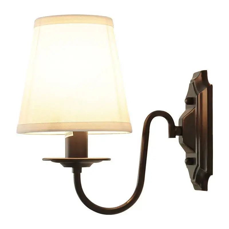 Antique bronze-finished decorbites black iron wall lamp with cream fabric shade for elegant rural bedroom and living room