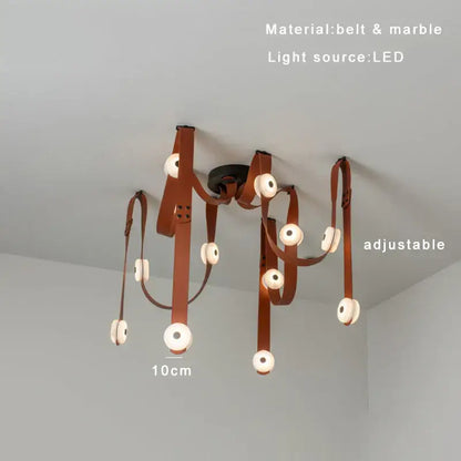 A decorbites black leather marble chandelier with adjustable arms and circular led lights for dining room decor